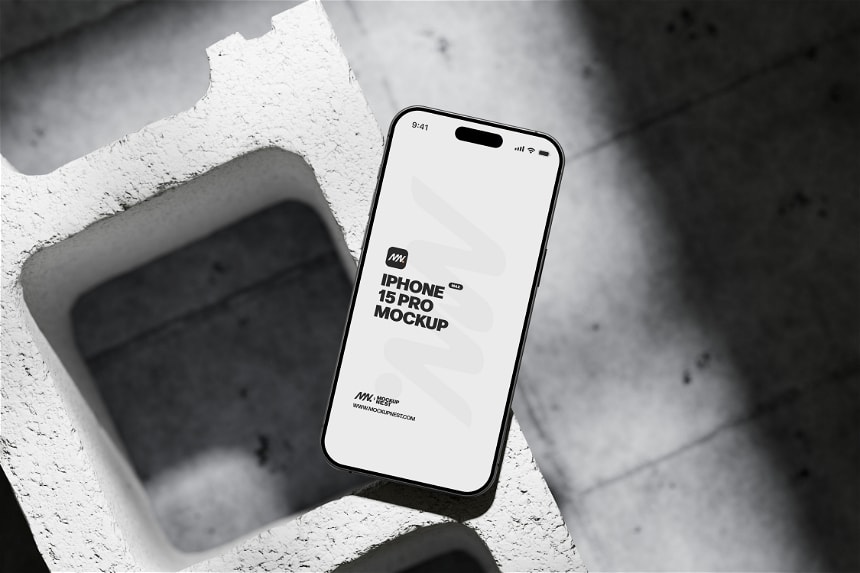 Free Iphone 15 Pro On Concrete Brick Mockup