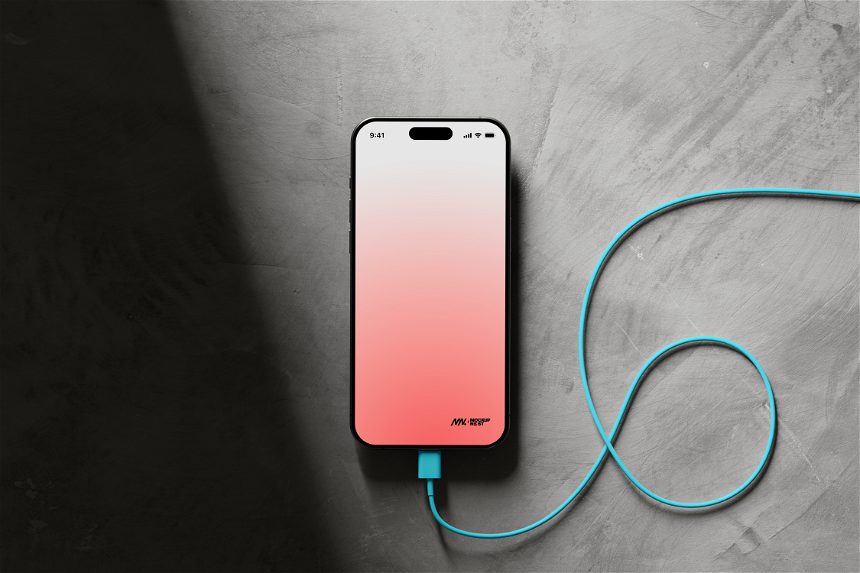 Free iPhone 15 Pro Mockup With Cable in a Dark Environment