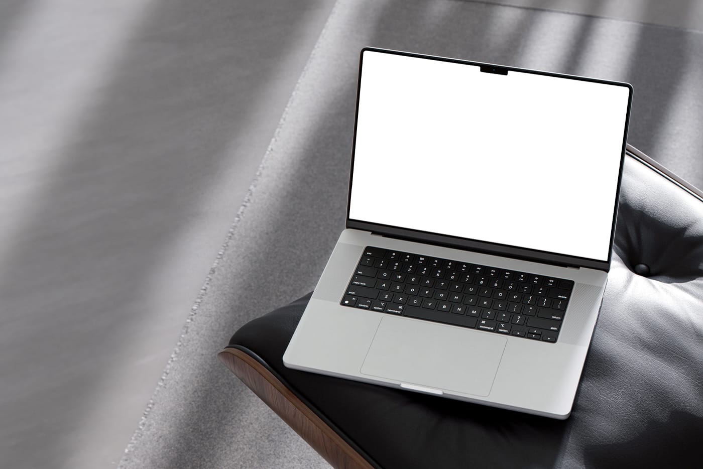 Free MacBook Pro on Chair Mockup White Screen