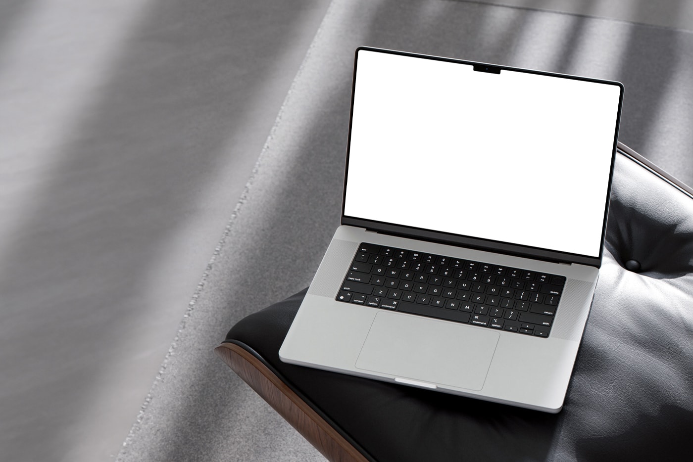 Free MacBook Pro on Chair Mockup White Screen