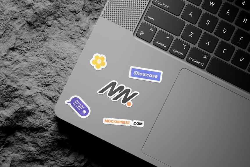 laptop sticker mockup on rock mockup