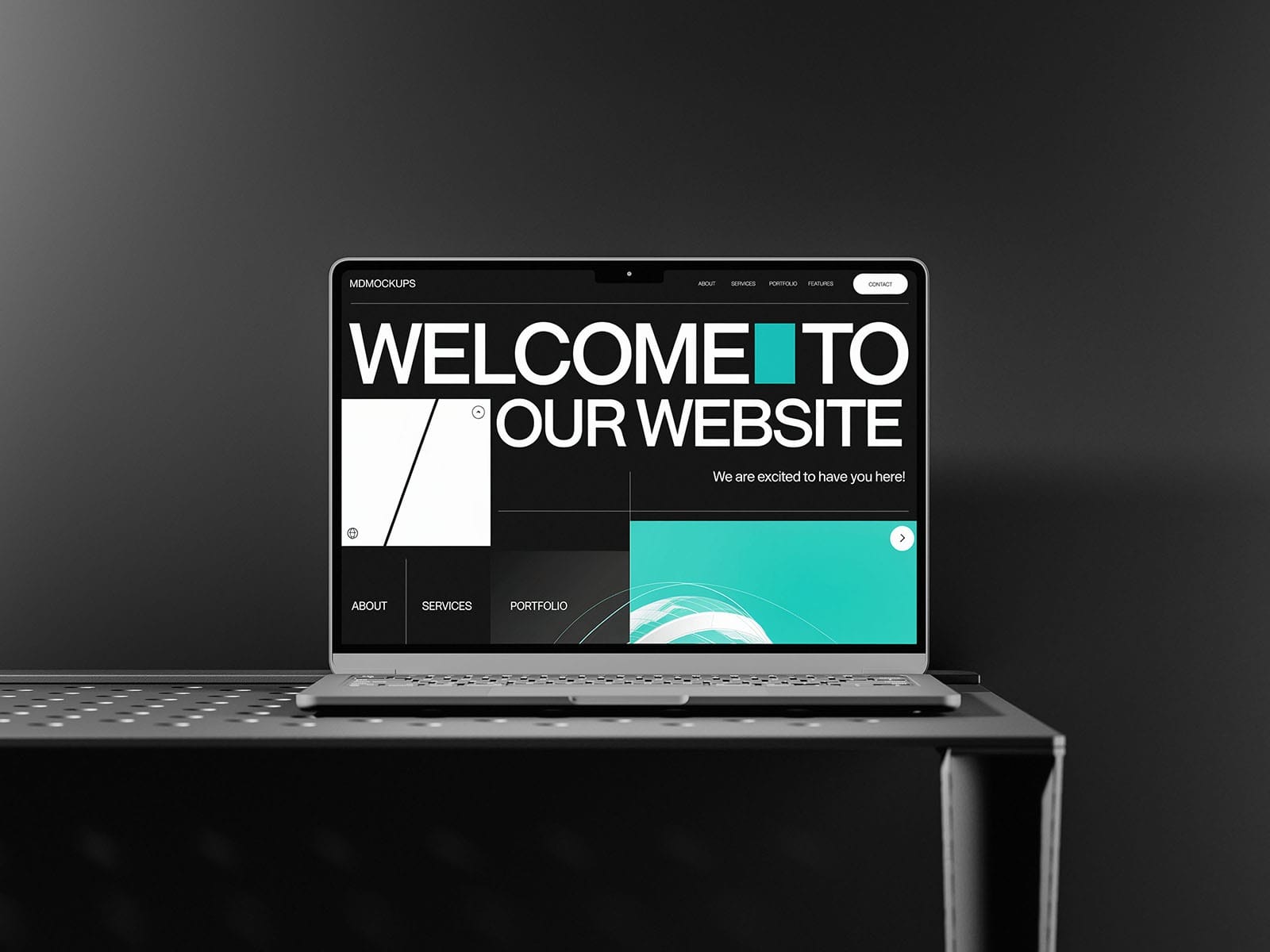 free macbook mockup on black table