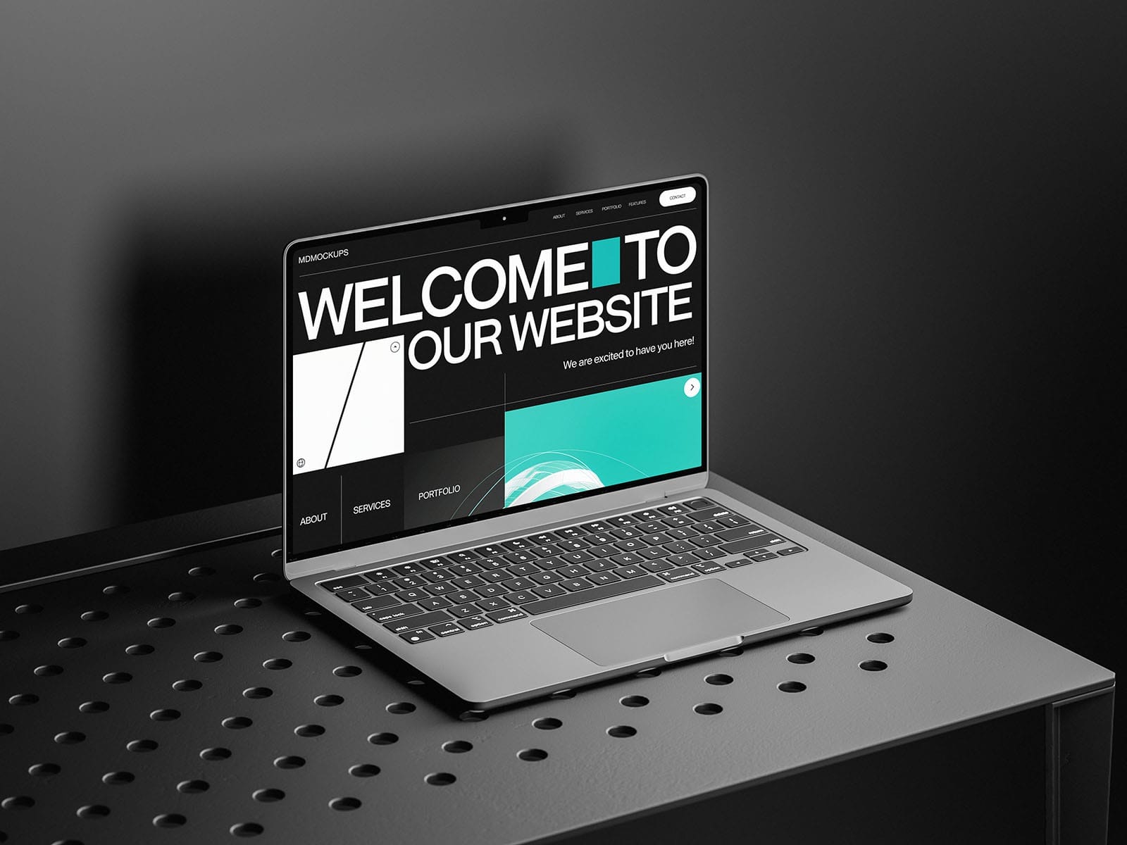 free macbook mockup on black table