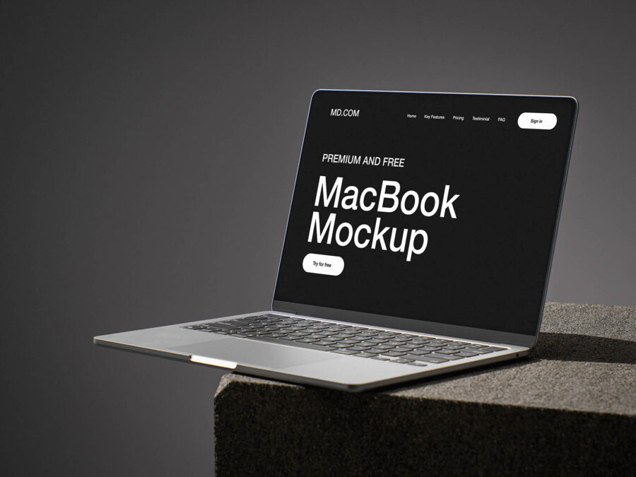 free macbook mockup on concrete cube