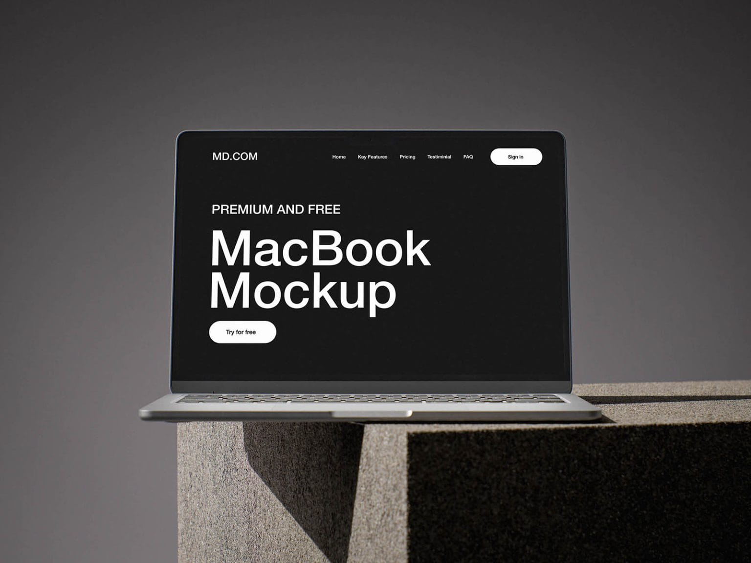 free macbook mockup on concrete cube