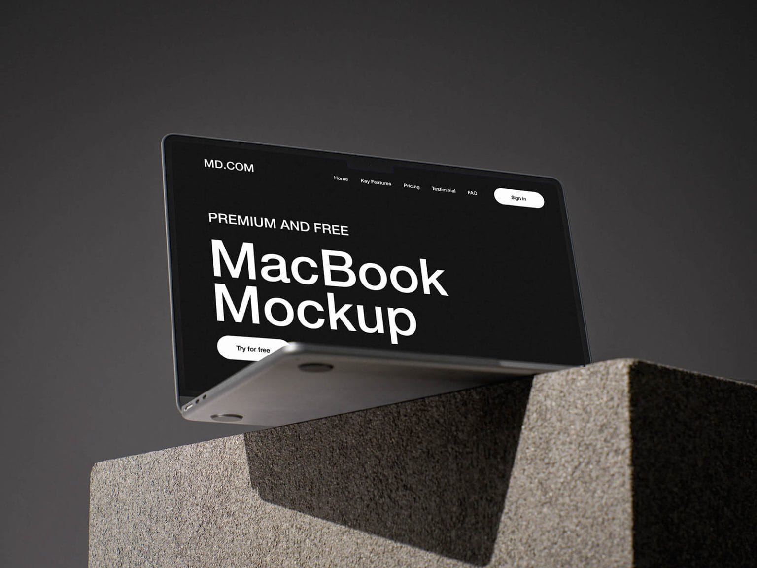 free macbook mockup on concrete cube
