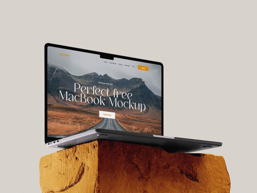 free macbook mockup on stone in left view