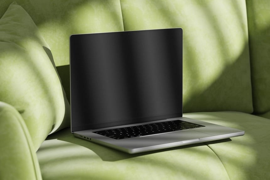 free macbook pro mockup on sofa