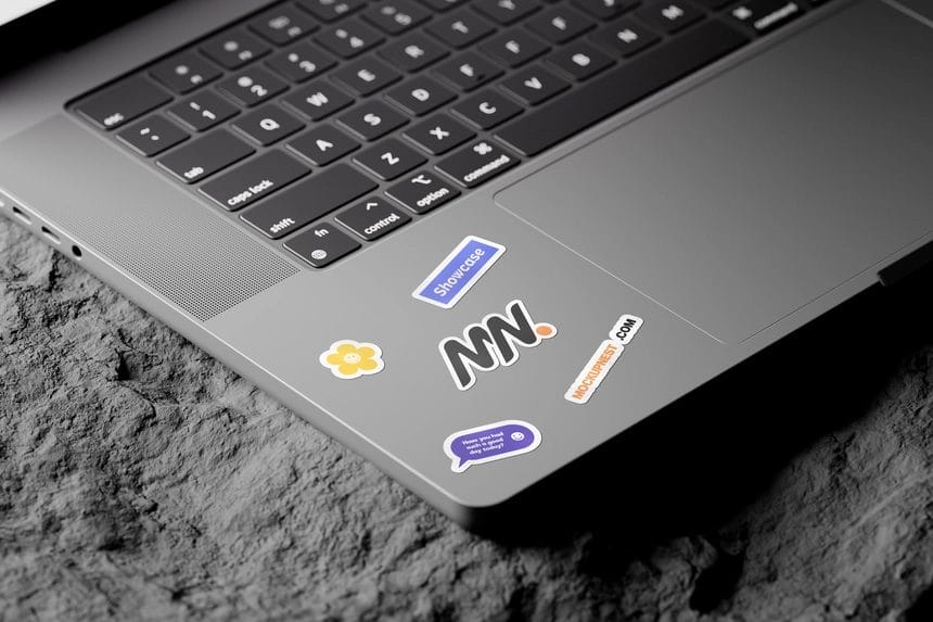 laptop sticker mockup on rock mockup