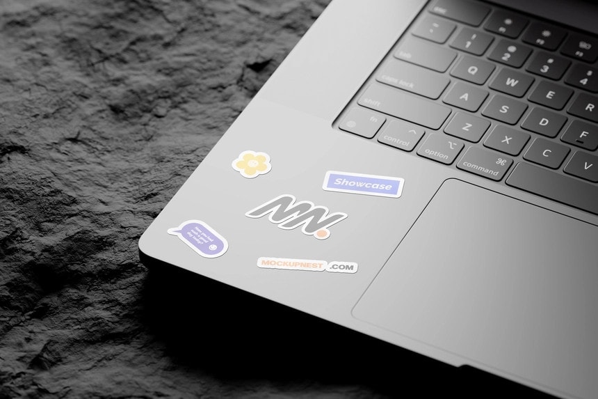 laptop sticker mockup on rock mockup
